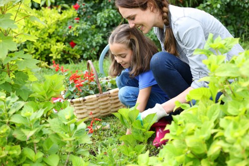 Professional gardening team applying a careful health and safety policy